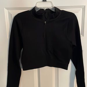 Woman’s long sleeved black active top